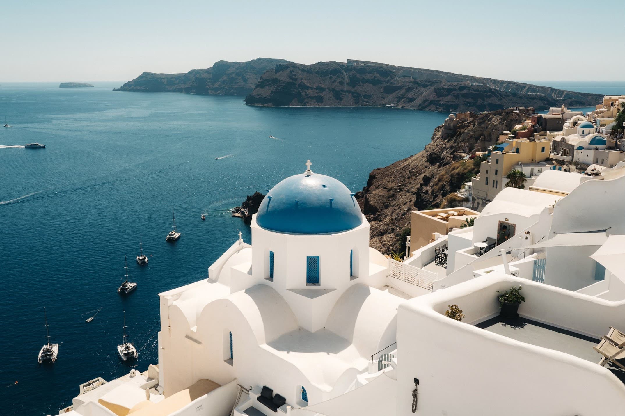 A blue-domed church above the caldera in Oia, Santorini
