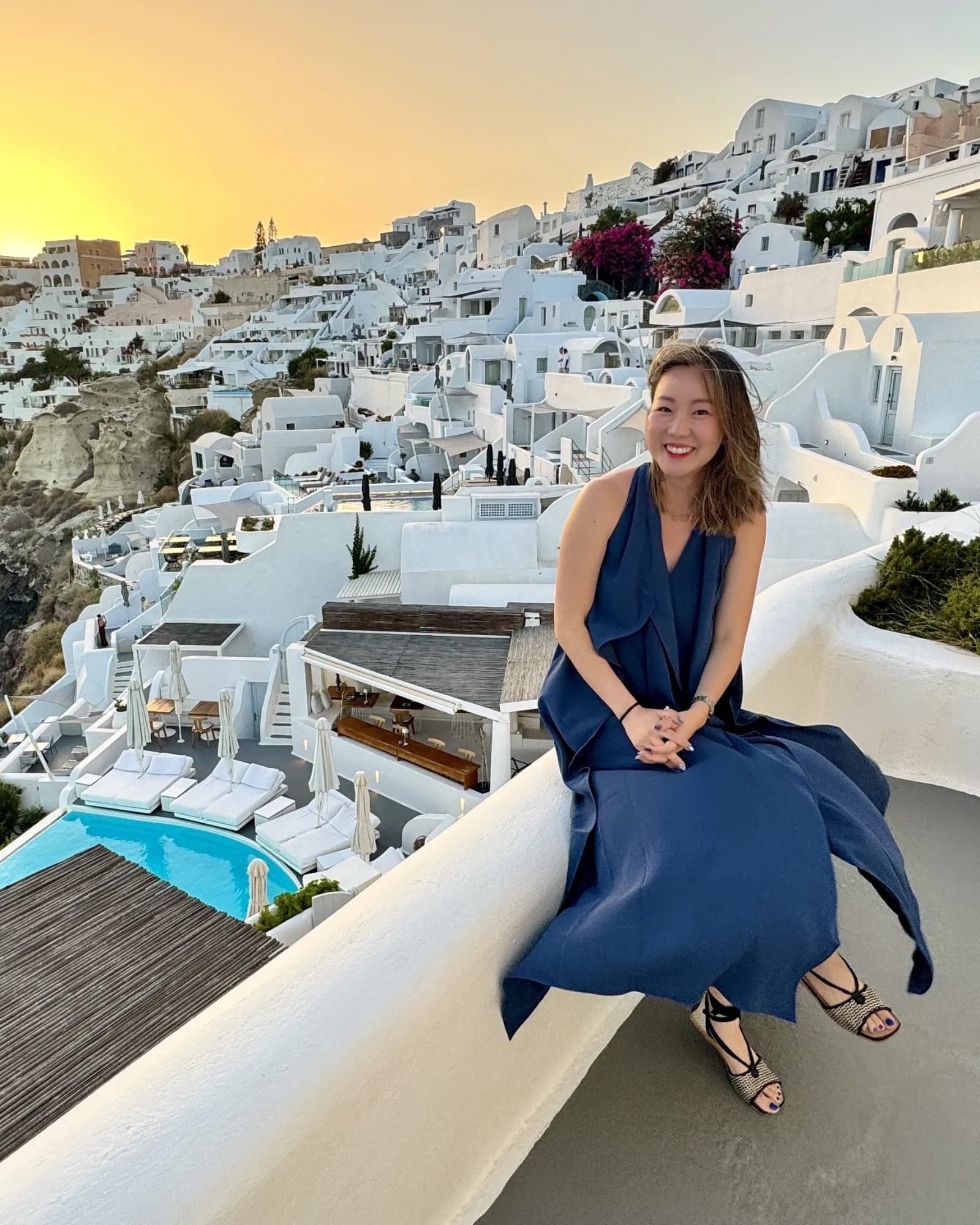 Kerry on a terrace in Oia, Santorini, at sunset